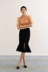 Silk flared midi skirt with front slit and pom-pom trim hem for elegant movement